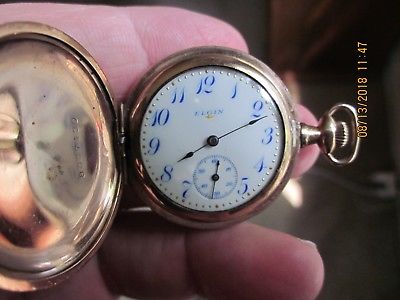 Elgin 0 size gold-filled Hunter case/blue numeral dial/good condition/running
