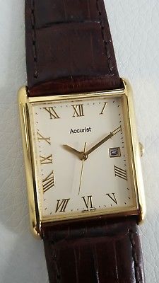 Accurist dress watch unisex leather band gold tone.